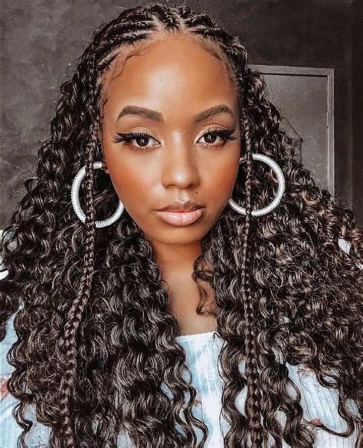 Dive Into The World Of Middle Part Tribal Braids With Curls